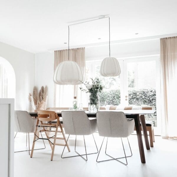 Lightswing twin white with two big pendant lights above dinging table.